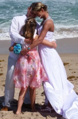 Sara with her family on their wedding day