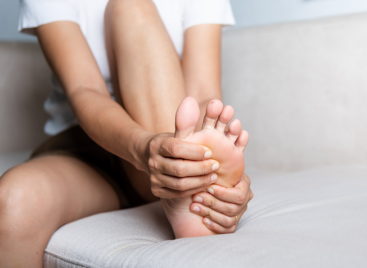 Woman holding her foot